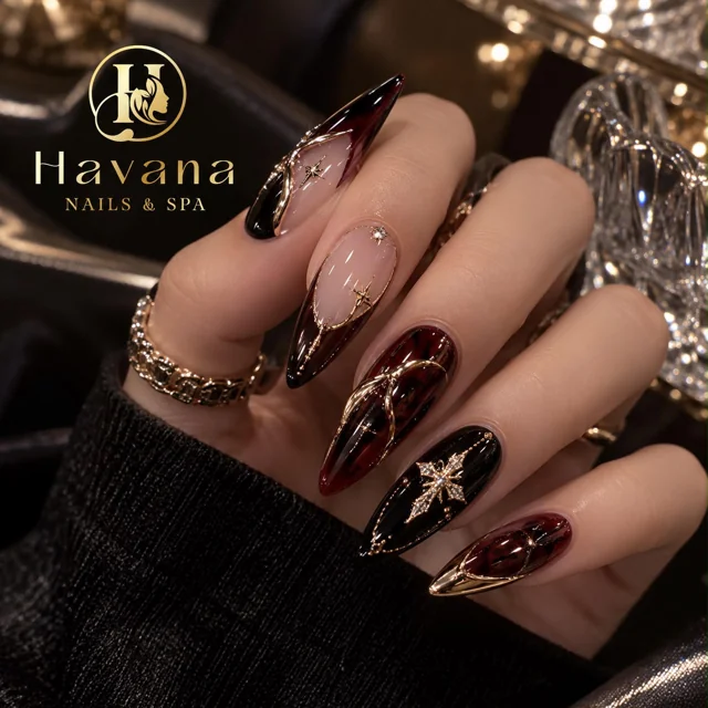 Havana deep red stiletto acrylic nails with gold details